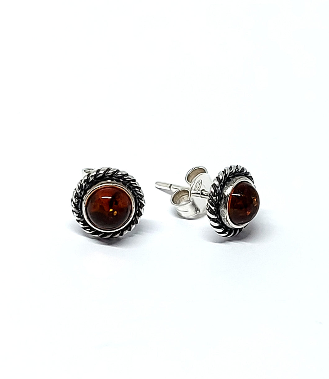 <transcy>Amber ear studs 10 mm with twisted edge (925)</transcy>