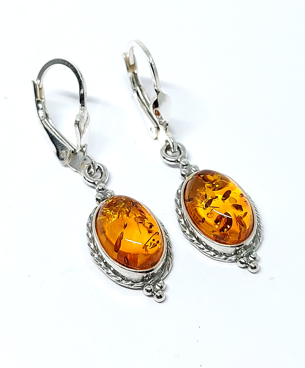 Amber hanging earrings with Celtic pattern (925)