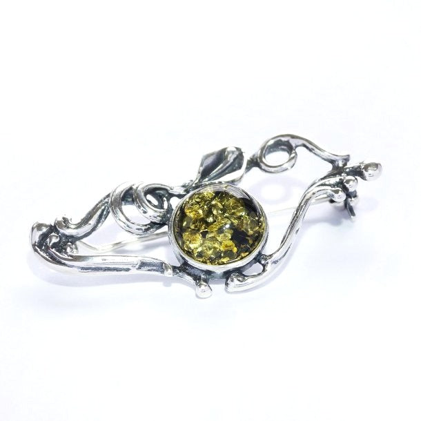 Brooch with green amber and antique pattern (925)